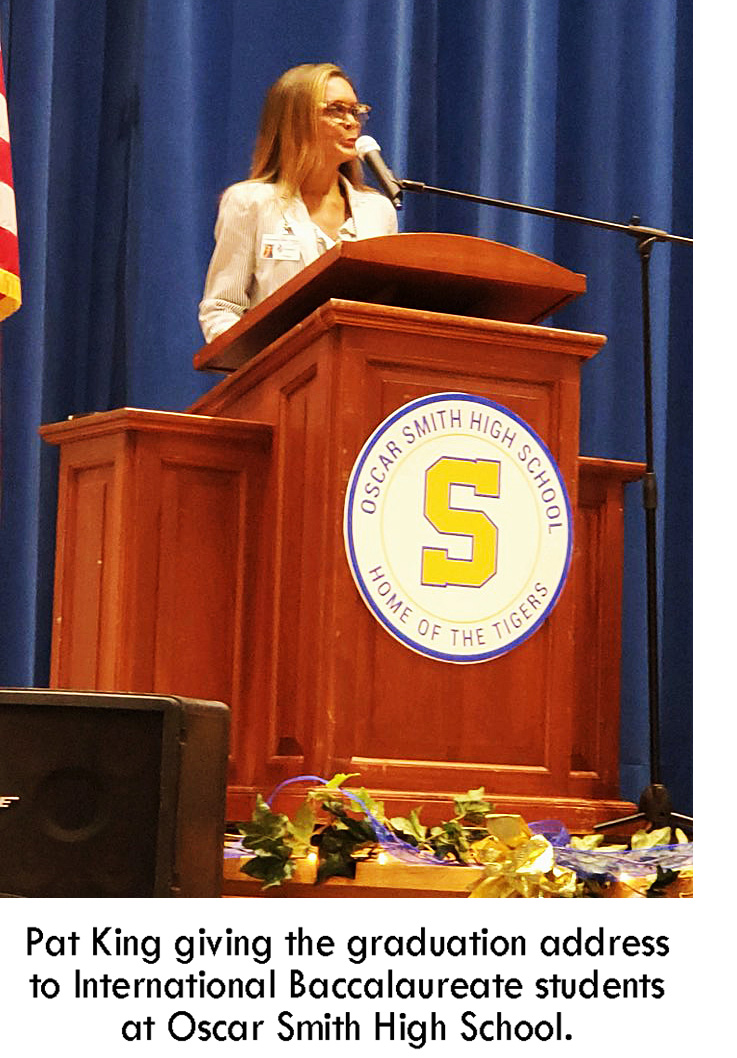 Pat King giving the graduation address to International Baccalaureate students at Oscar Smith High School